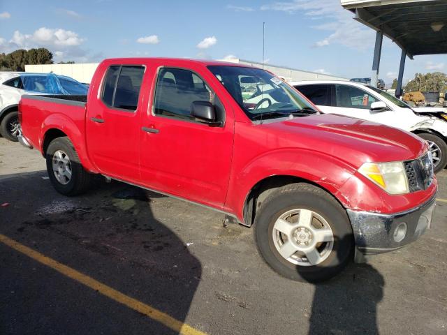 1N6AD07UX6C423318 - 2006 NISSAN FRONTIER CREW CAB LE RED photo 4