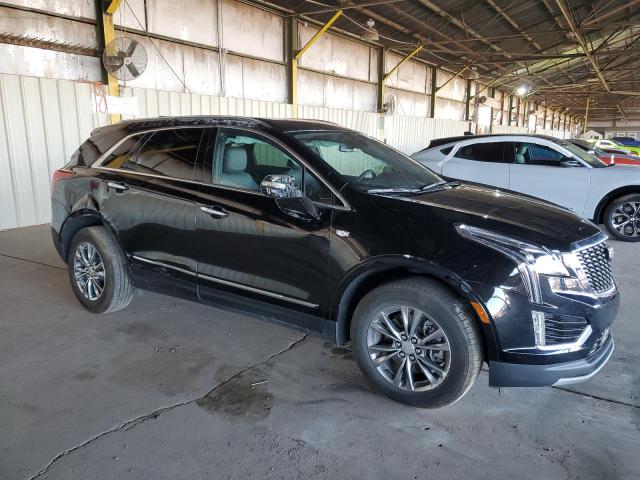 1GYKNCRSXPZ144140 - 2023 CADILLAC XT5 PREMIUM LUXURY BLACK photo 4