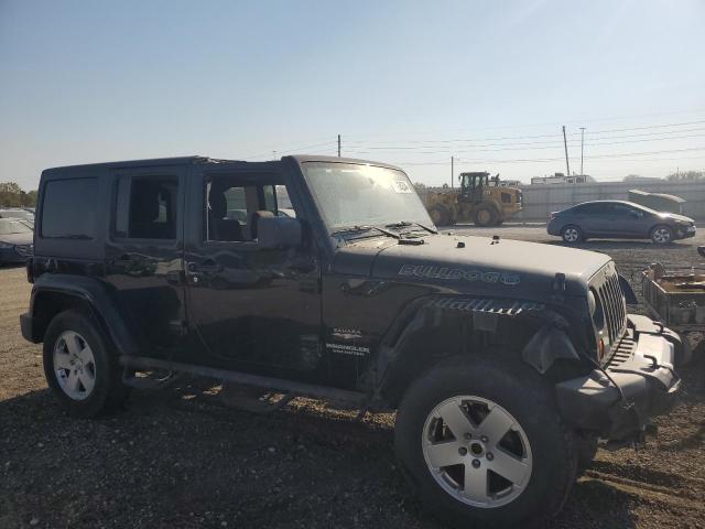 1J4BA5H10BL634002 - 2011 JEEP WRANGLER SAHARA BLACK photo 4