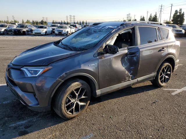 JTMJJREV1JD231882 - 2018 TOYOTA RAV4 HV SE SILVER photo 1