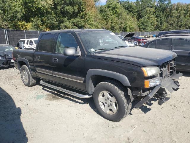 2GCEK13T751225412 - 2005 CHEVROLET SILVERADO K1500 BLACK photo 4