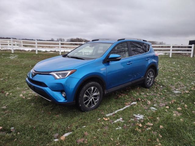 JTMRJREVXHD142289 - 2017 TOYOTA RAV4 HV LE BLUE photo 2