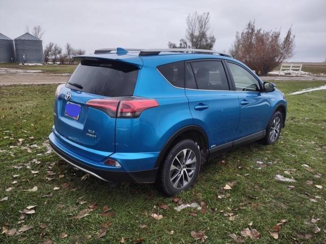 JTMRJREVXHD142289 - 2017 TOYOTA RAV4 HV LE BLUE photo 4