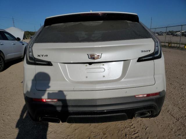 1GYFZER45NF100483 - 2022 CADILLAC XT4 SPORT WHITE photo 6