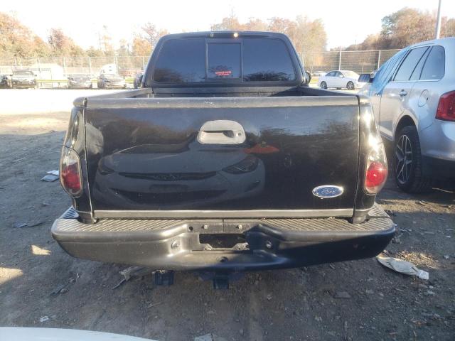 2FTRF07314CA58915 - 2004 FORD F150 SVT LIGHTNING BLACK photo 6