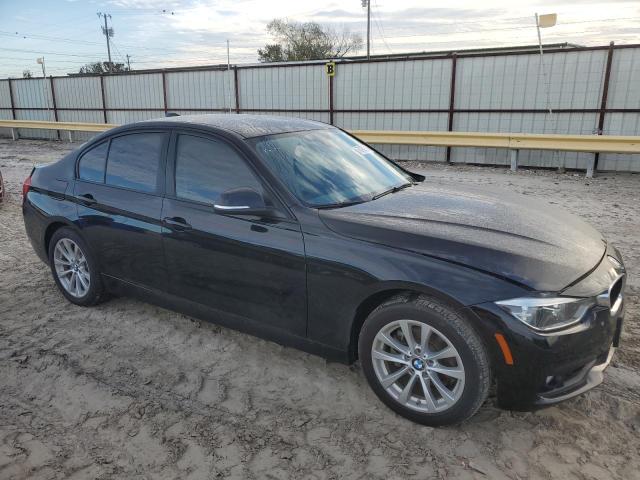 WBA8A9C58JAH13431 - 2018 BMW 320 I BLACK photo 4