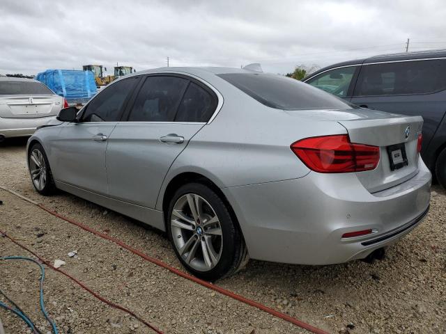 WBA8B9C58JEE80883 - 2018 BMW 330 I SILVER photo 2