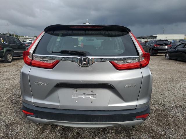 2HKRW6H36KH211099 - 2019 HONDA CR-V LX SILVER photo 6