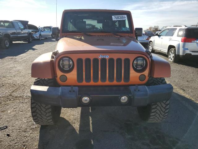 1J4HA5H14AL227454 - 2010 JEEP WRANGLER U SAHARA ORANGE photo 5