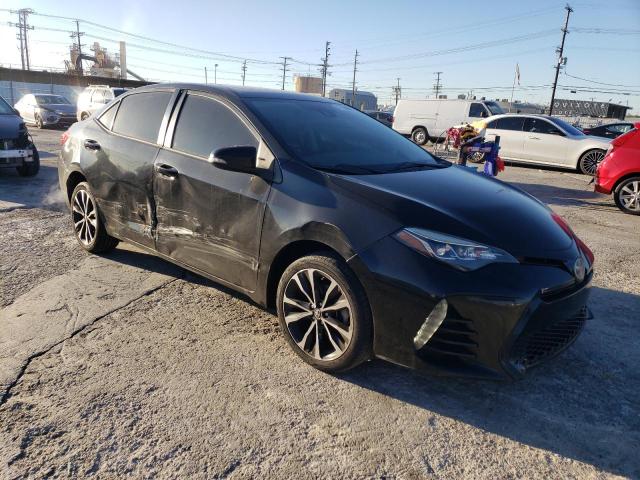 5YFBURHE9HP670679 - 2017 TOYOTA COROLLA L BLACK photo 4