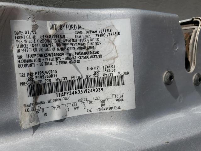 1FAFP34NX5W249039 - 2005 FORD FOCUS ZX4 SILVER photo 12