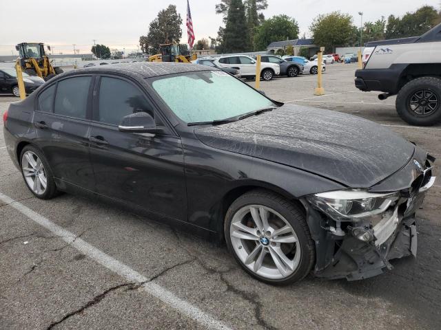 WBA8A9C54JK623099 - 2018 BMW 320 I BLACK photo 4