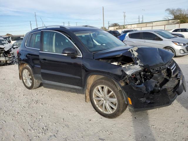 WVGAV7AX2BW527429 - 2011 VOLKSWAGEN TIGUAN S BLACK photo 4