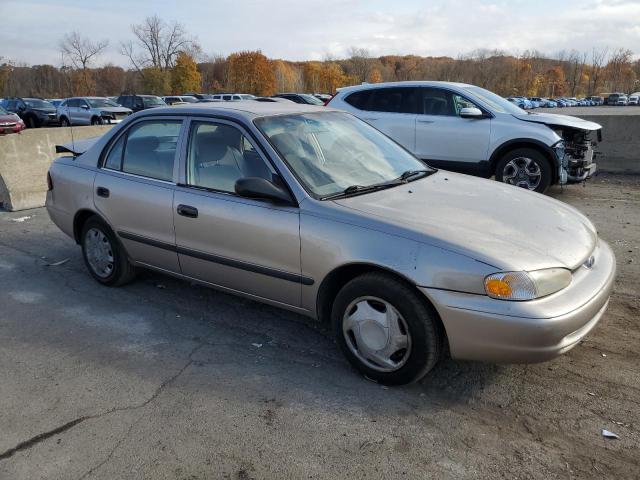1Y1SK5484XZ401262 - 1999 CHEVROLET GEO PRIZM BASE TAN photo 4
