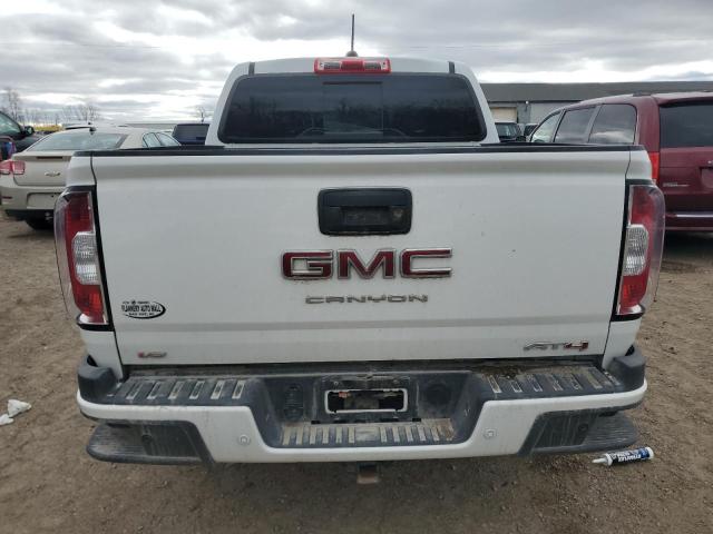 1GTG6FEN9M1117578 - 2021 GMC CANYON AT4 WHITE photo 6