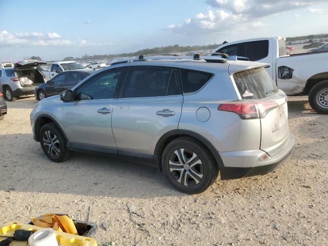 2T3ZFREV9GW273877 - 2016 TOYOTA RAV4 LE SILVER photo 2