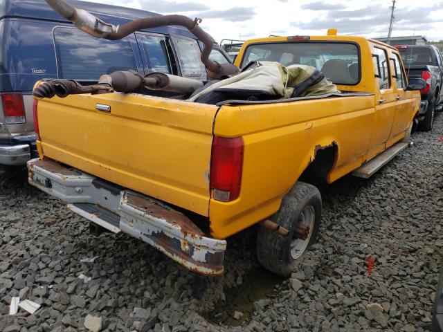 1FTJW36H2VEA94359 - 1997 FORD F350 YELLOW photo 4