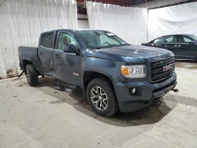 1GTG6FEN2K1258182 - 2019 GMC CANYON ALL TERRAIN BLUE photo 4