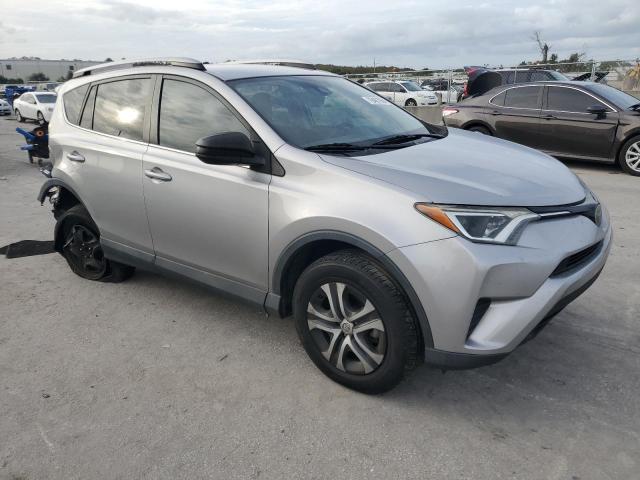 2T3ZFREV5HW391779 - 2017 TOYOTA RAV4 LE SILVER photo 4