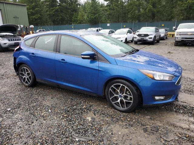 1FADP3M23JL323247 - 2018 FORD FOCUS SEL BLUE photo 4