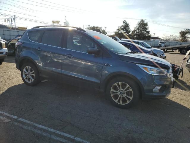 1FMCU0GD5JUA02858 - 2018 FORD ESCAPE SE BLUE photo 4