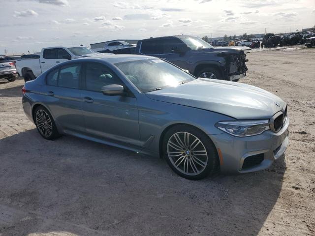 WBAJB9C52KB287937 - 2019 BMW M550XI GRAY photo 4