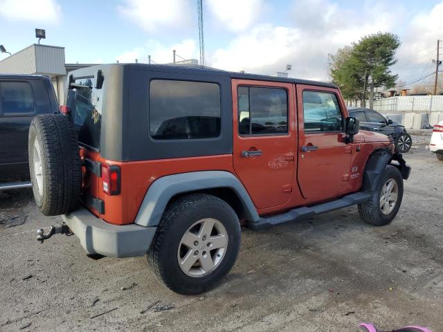 1J4GA39189L767447 - 2009 JEEP WRANGLER U X ORANGE photo 3