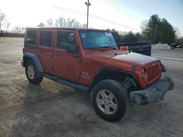 1J4GA39189L767447 - 2009 JEEP WRANGLER U X ORANGE photo 4