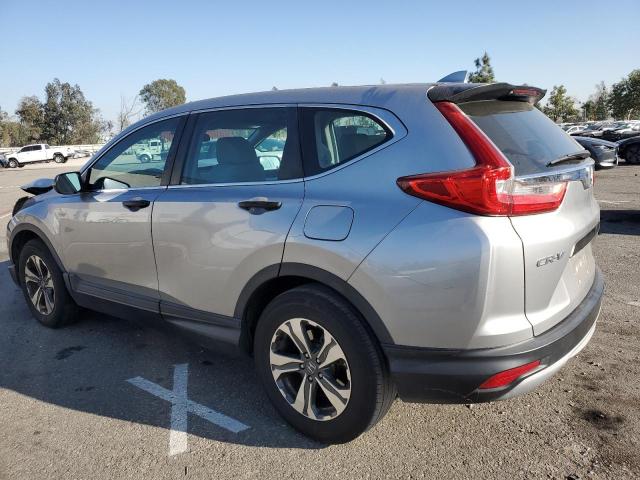 2HKRW5H31KH414489 - 2019 HONDA CR-V LX SILVER photo 2