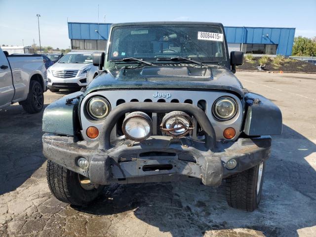 1J4BA5H1XAL125839 - 2010 JEEP WRANGLER U SAHARA Yaşıl foto 5