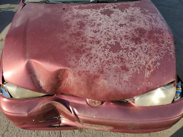 1Y1SK5483YZ404526 - 2000 CHEVROLET GEO PRIZM BASE RED photo 11