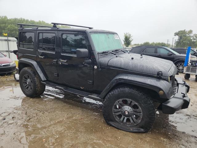1J4HA5H10BL530149 - 2011 JEEP WRANGLER U SAHARA BLACK photo 4