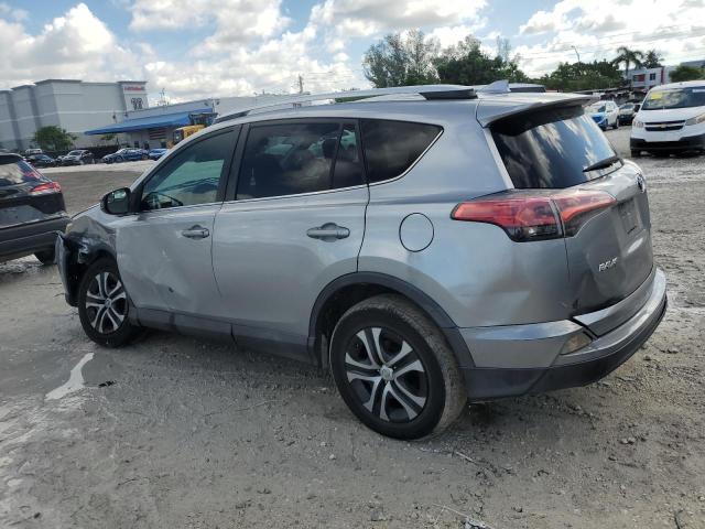 2T3ZFREV8GW246766 - 2016 TOYOTA RAV4 LE SILVER photo 2