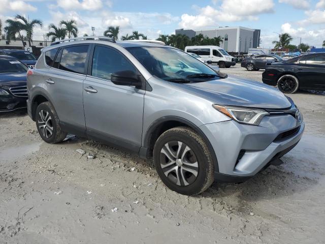 2T3ZFREV8GW246766 - 2016 TOYOTA RAV4 LE SILVER photo 4