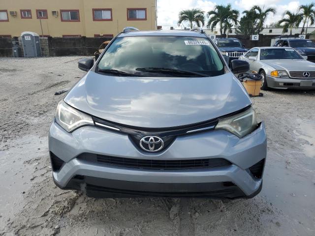 2T3ZFREV8GW246766 - 2016 TOYOTA RAV4 LE SILVER photo 5