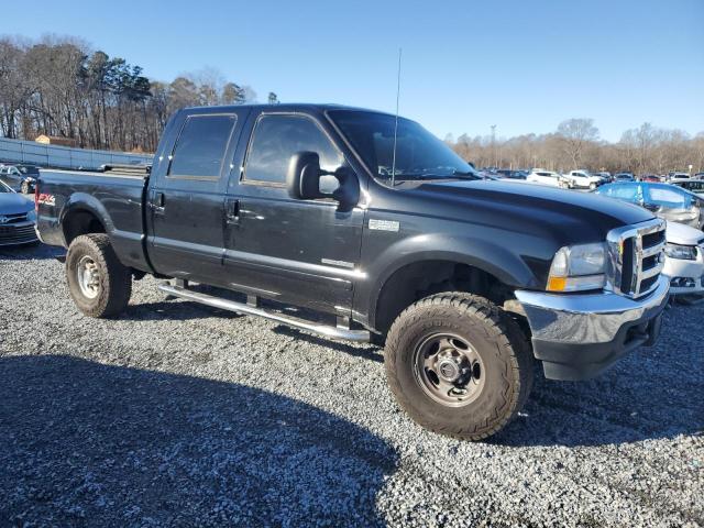 1FTSW31F42EC72178 - 2002 FORD F350 SRW SUPER DUTY BLACK photo 4