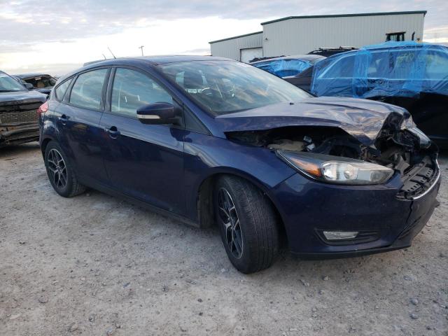 1FADP3M20HL203397 - 2017 FORD FOCUS SEL BLUE photo 4