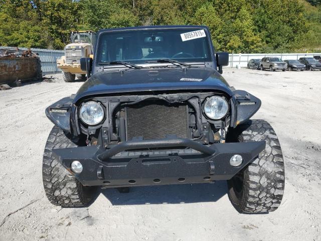 1C4BJWDG4HL607562 - 2017 JEEP WRANGLER U SPORT ნაცრისფერი ფოტო 5