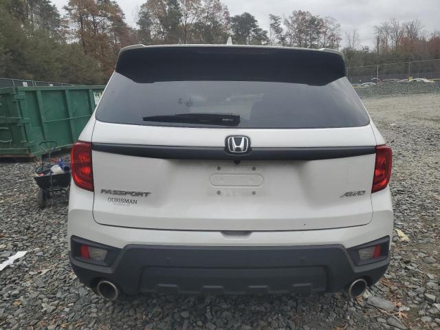 5FNYF8H50PB040929 - 2023 HONDA PASSPORT EXL WHITE photo 6