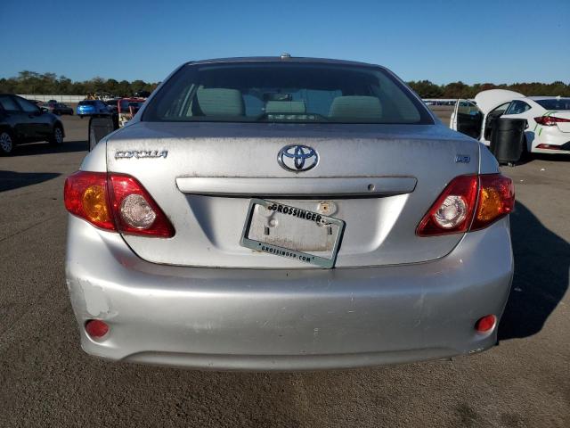 1NXBU40E99Z126472 - 2009 TOYOTA COROLLA BASE Silber Foto 6