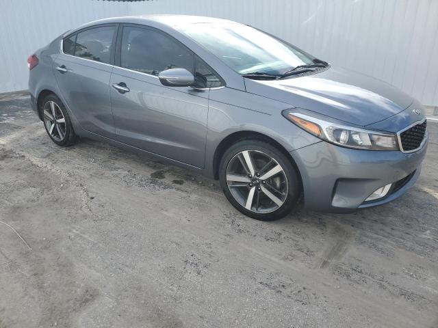 3KPFL4A87JE221018 - 2018 KIA FORTE EX GRAY photo 4