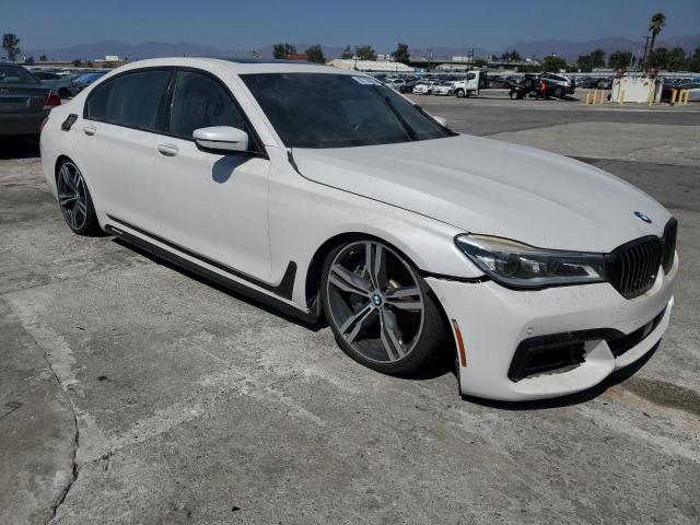 WBA7F0C54HGM21014 - 2017 BMW 750 I Белый фото 4