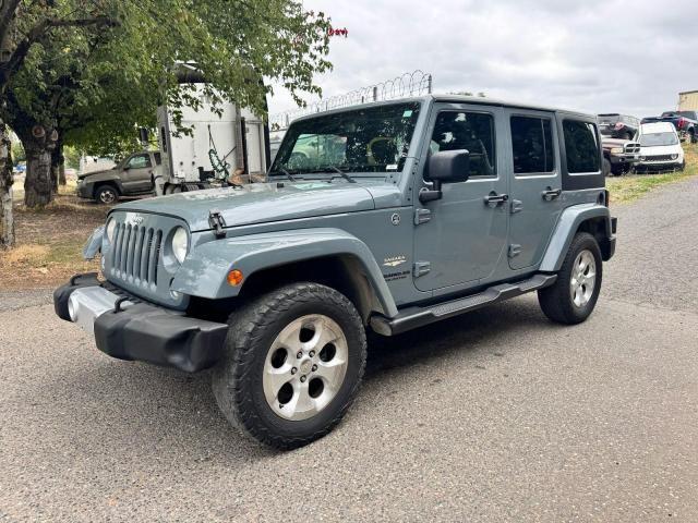 1C4BJWEG1EL304085 - 2014 JEEP WRANGLER U SAHARA GRAY photo 2