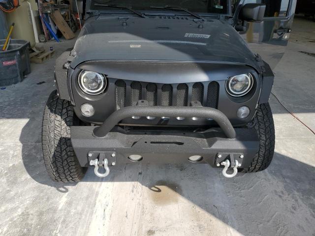 1C4AJWAGXGL295231 - 2016 JEEP WRANGLER SPORT GRAY photo 11