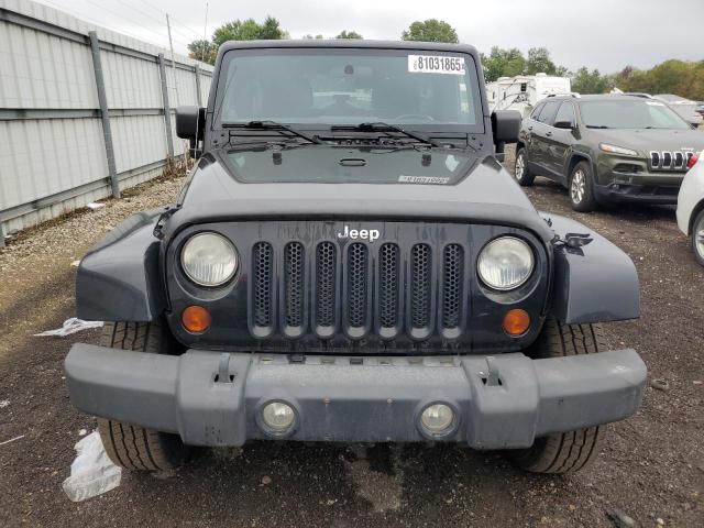 1J4BA5H14BL573463 - 2011 JEEP WRANGLER U SAHARA შავი ფოტო 5