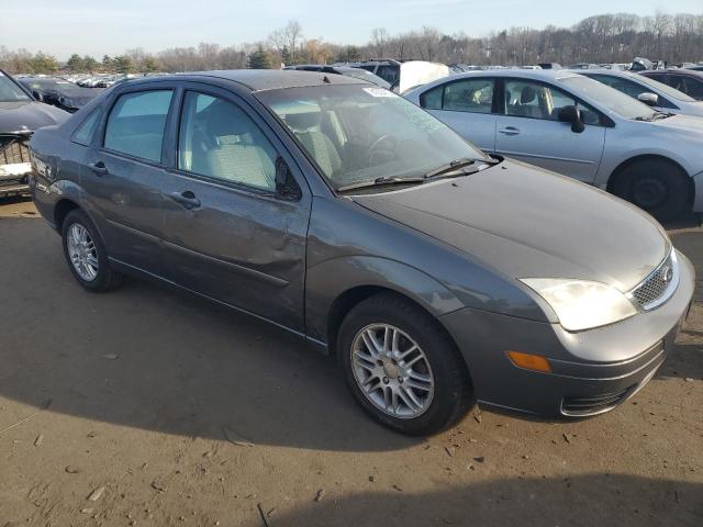 1FAHP34N17W325582 - 2007 FORD FOCUS ZX4 GRAY photo 4