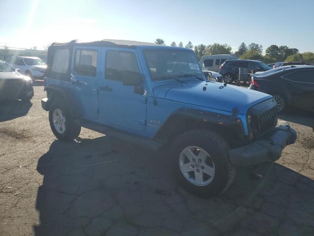 1J4HA3H10AL150800 - 2010 JEEP WRANGLER U SPORT Синий фото 4