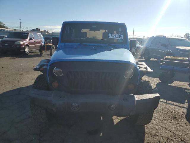 1J4HA3H10AL150800 - 2010 JEEP WRANGLER U SPORT Синий фото 5