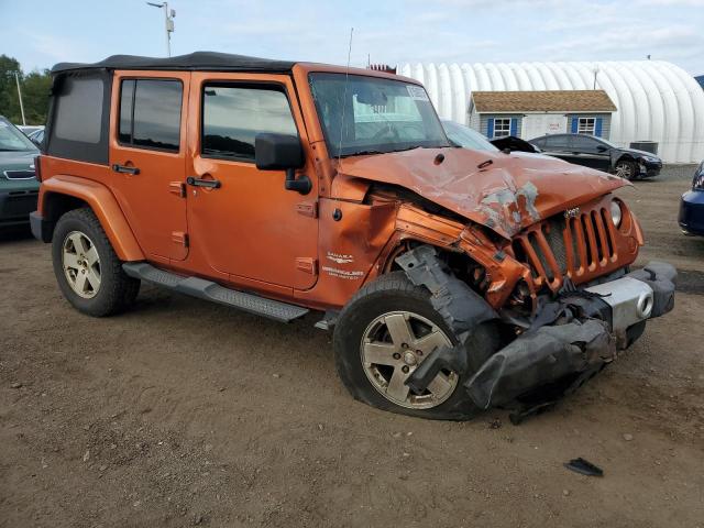 1J4HA5H15BL590766 - 2011 JEEP WRANGLER UNLIMITED SAHARA ORANGE photo 4