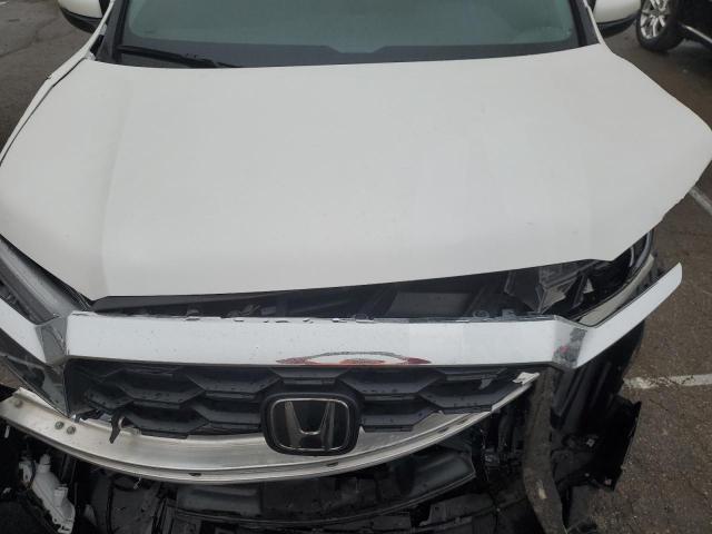 5FNYF8H55PB011149 - 2023 HONDA PASSPORT EXL WHITE photo 11